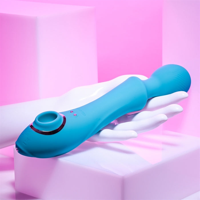 Wanderful Sucker Rechargeable Sucking Wand Vibrator by Evolved out of box side view in hand.