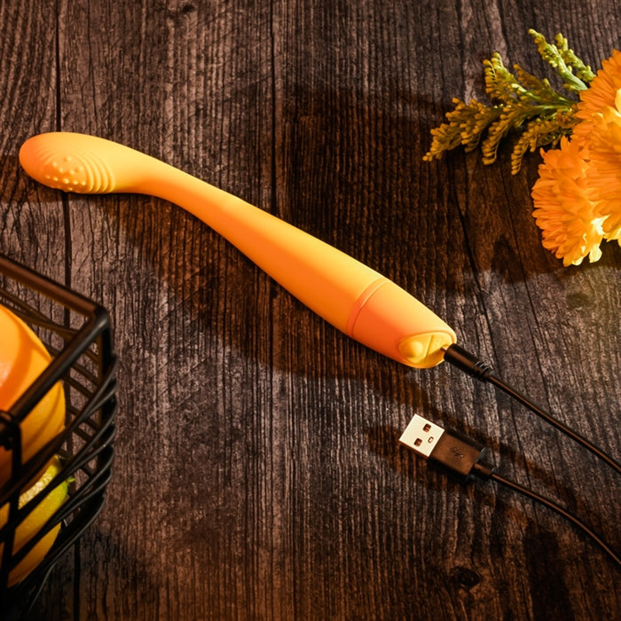 Lemon Squeeze Rechargeable Slim G-Spot Vibrator in yellow from Selopa, out of box side view of charging port and cable.