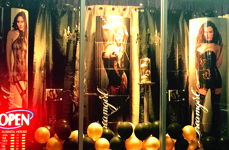 Sex positive movement friendly adult store in Parksville black and gold themed window display