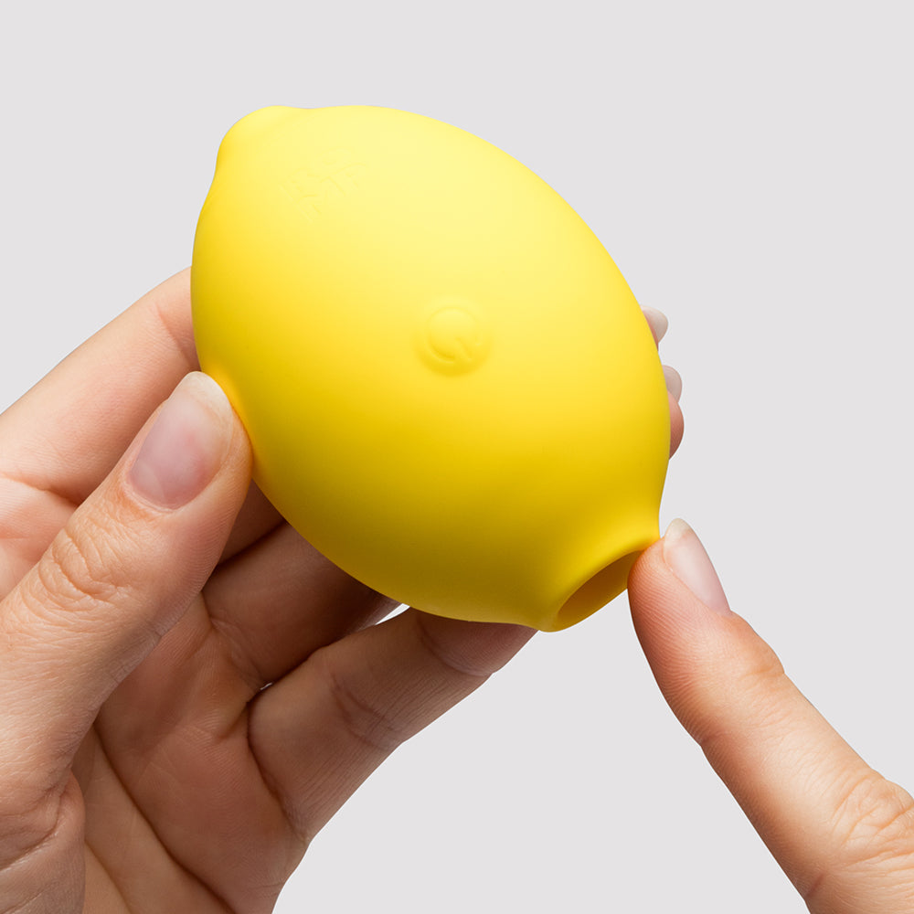 Romp Lemon Crush Pleasure Air Clitoral Stimulator in Hand