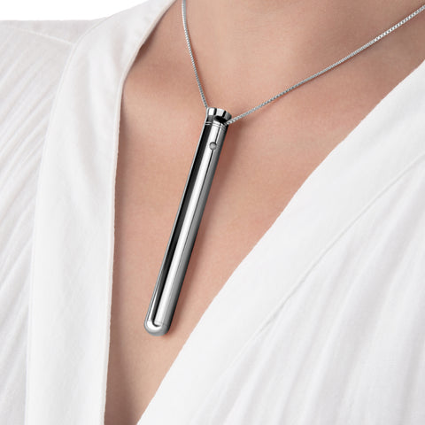 Le Wand Discreet Rechargeable Necklace Vibrator in silver worn on neck