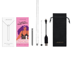 Le Wand Discreet Rechargeable Necklace Vibrator in silver out of box showing all parts incluced and pamphlet