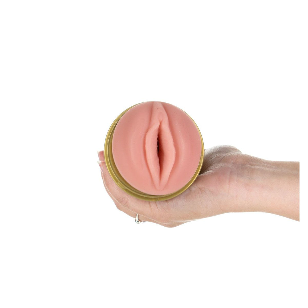 Fleshlight GO Stamina Training Unit Travel Size Out of packaging, held in hand. 