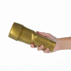 Fleshlight GO Stamina Training Unit Travel Size out of packaging, hard case held in a hand.