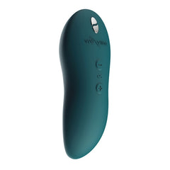 We-Vibe Touch X Magic Multitasker Vibe in velvet green  at an angle showing it's sleek and compact design